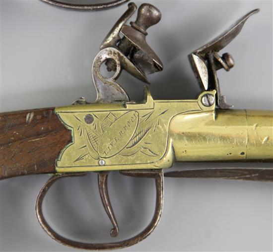 A pair of brass framed and barrelled flintlock boxlock pocket pistols, 8in. (11in with bayonet)